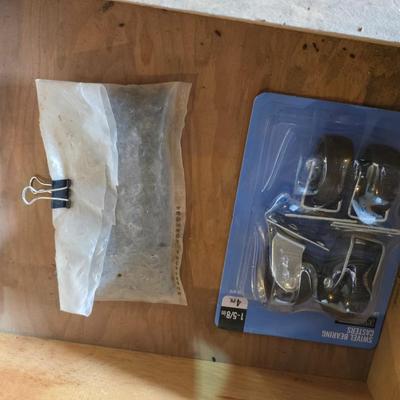 Assortment of home hardware - new caster wheels - screws - nails - Large rat traps - new in the bag hardware
