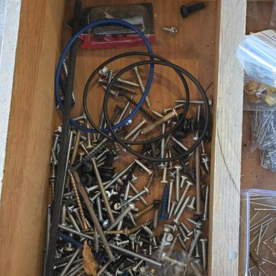 Assortment of home hardware - new caster wheels - screws - nails - Large rat traps - new in the bag hardware