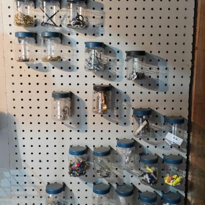 Pegboard mounted lidded containers with hardware