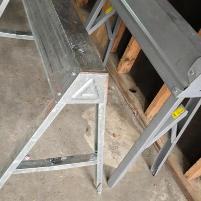 Two metal foldable / collapsable sawhorses