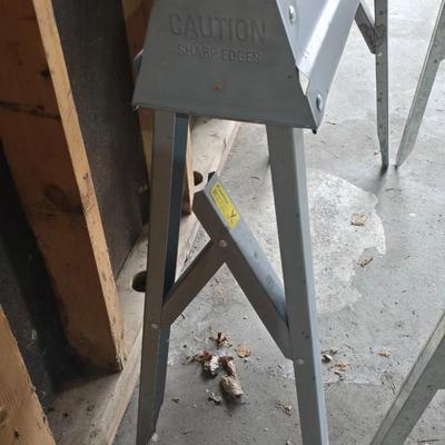 Two metal foldable / collapsable sawhorses