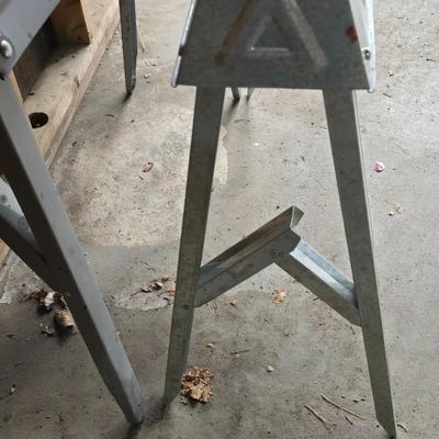 Two metal foldable / collapsable sawhorses