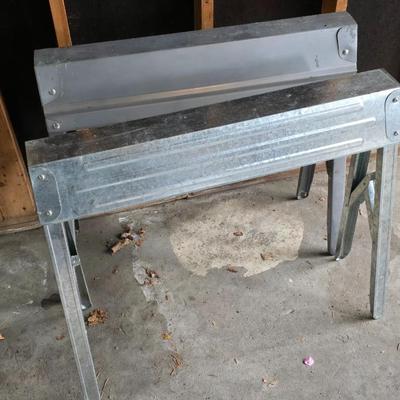Two metal foldable / collapsable sawhorses