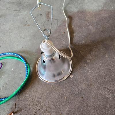 Two extension cords, a handing light and a few bungee cords