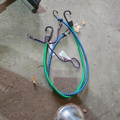 Two extension cords, a handing light and a few bungee cords