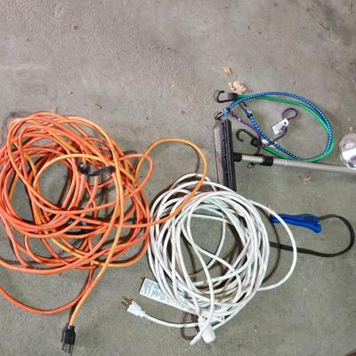 Two extension cords, a handing light and a few bungee cords