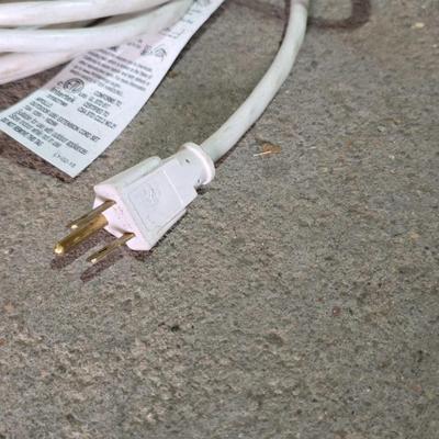 Two extension cords, a handing light and a few bungee cords