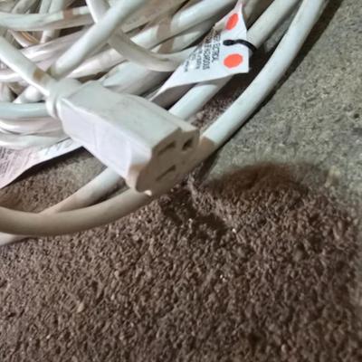 Two extension cords, a handing light and a few bungee cords