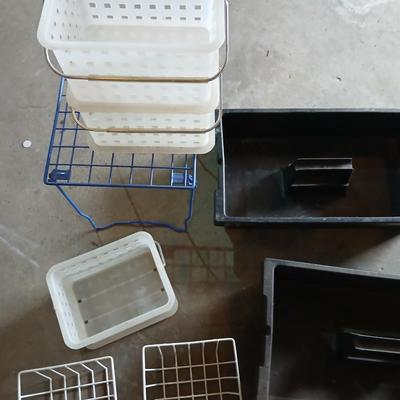 Grouping of storage baskets and racks and a multi-use metal organizer rack