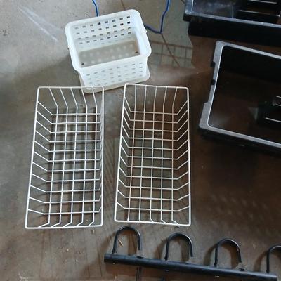 Grouping of storage baskets and racks and a multi-use metal organizer rack