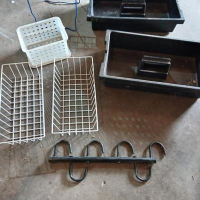 Grouping of storage baskets and racks and a multi-use metal organizer rack