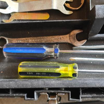 Small craftsman toolbox with an assortment of tools