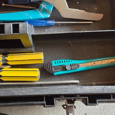 Small craftsman toolbox with an assortment of tools