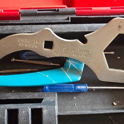 Small craftsman toolbox with an assortment of tools