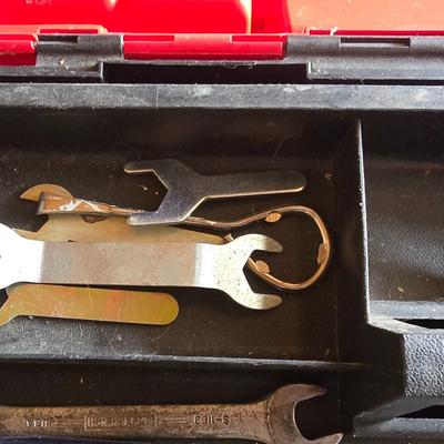 Small craftsman toolbox with an assortment of tools