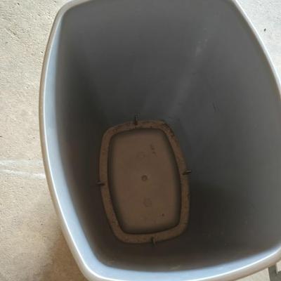 Wood 2 foot step ladder and a grey plastic trashcan