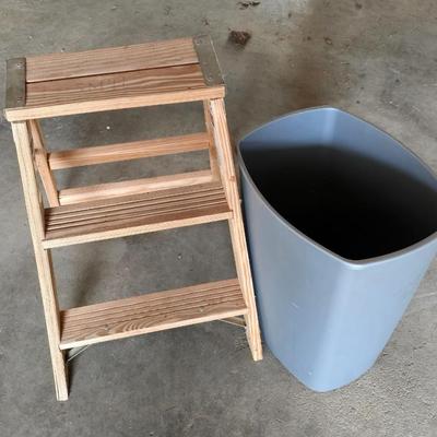 Wood 2 foot step ladder and a grey plastic trashcan