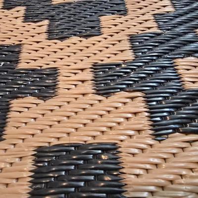 Black and brown reversible outdoor area rug 69" x 47"