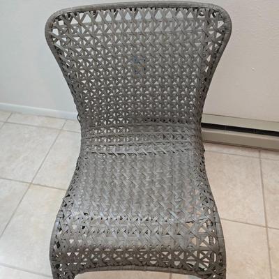 Brown woven Faux rattan lounge chair indoor/outdoor with a throw pillow