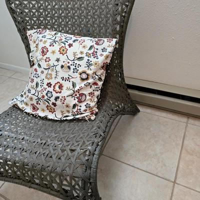 Brown woven Faux rattan lounge chair indoor/outdoor with a throw pillow