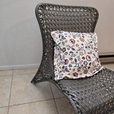 Brown woven Faux rattan lounge chair indoor/outdoor with a throw pillow