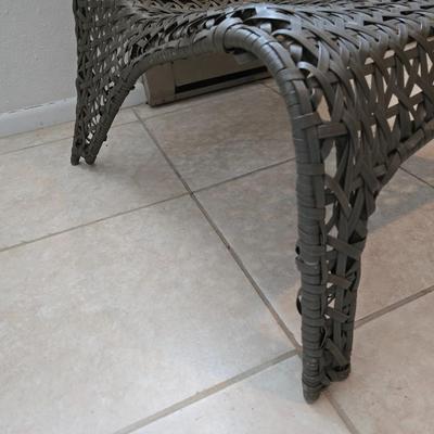 Brown woven Faux rattan lounge chair indoor/outdoor with a throw pillow