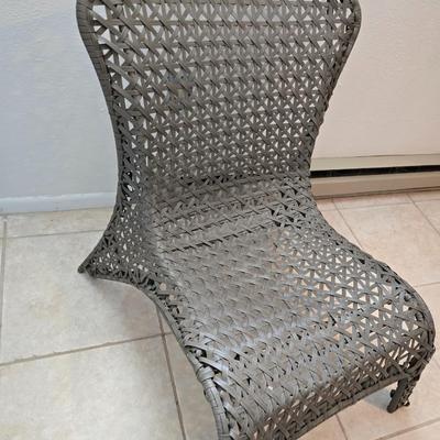Brown woven Faux rattan lounge chair indoor/outdoor with a throw pillow