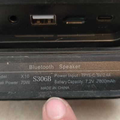 Nice W-KING Bluetooth Speaker with accessories and charging cord.