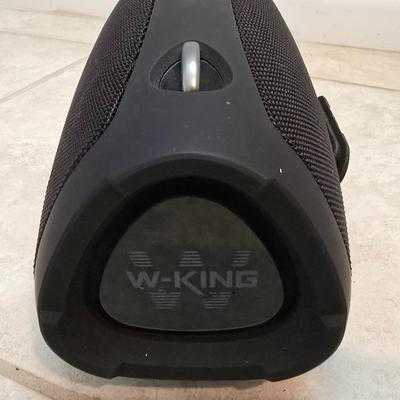 Nice W-KING Bluetooth Speaker with accessories and charging cord.
