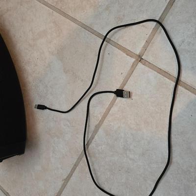 Nice W-KING Bluetooth Speaker with accessories and charging cord.