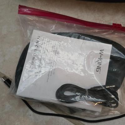 Nice W-KING Bluetooth Speaker with accessories and charging cord.