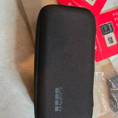 GoPro with Mongoose CM303 Helmet and accessories including two 64 GB UHS scandisk media storage cards