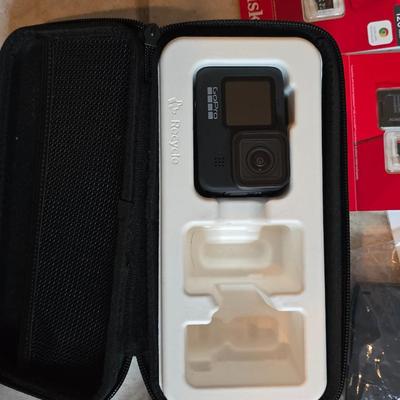GoPro with Mongoose CM303 Helmet and accessories including two 64 GB UHS scandisk media storage cards