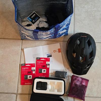 GoPro with Mongoose CM303 Helmet and accessories including two 64 GB UHS scandisk media storage cards