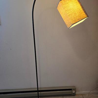 Sweeping curve 70"floor lamp with marble like base with adjustable neck