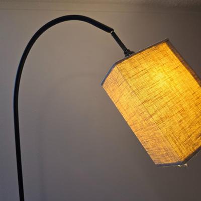 Sweeping curve 70"floor lamp with marble like base with adjustable neck