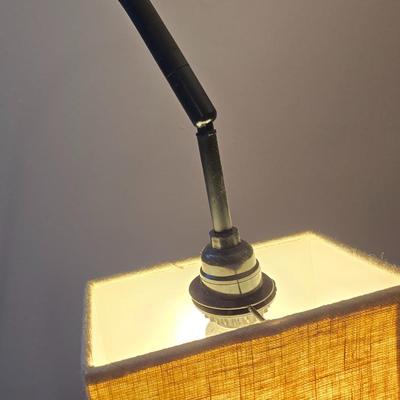 Sweeping curve 70"floor lamp with marble like base with adjustable neck