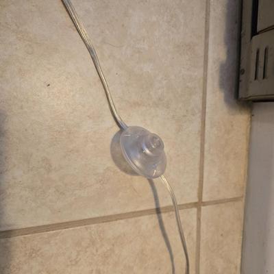Sweeping curve 70"floor lamp with marble like base with adjustable neck