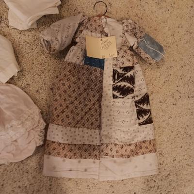 ANTIQUE DOLL DRESS AND OLDER DOLL CLOTHES PLUS RABBIT DISHES