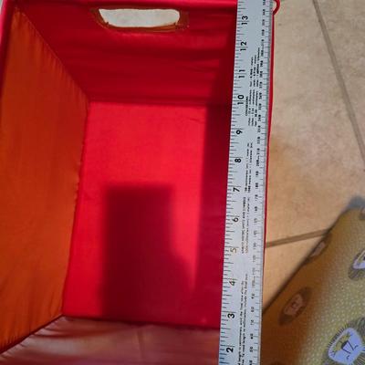 Three canvas like storage baskets and two picture frames