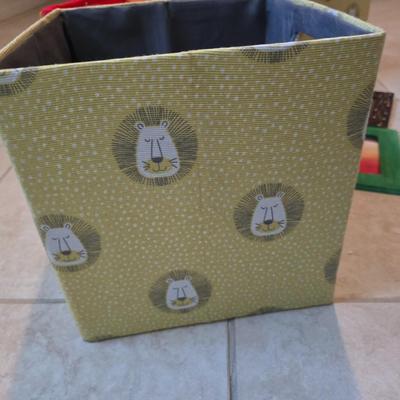 Three canvas like storage baskets and two picture frames