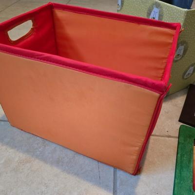 Three canvas like storage baskets and two picture frames