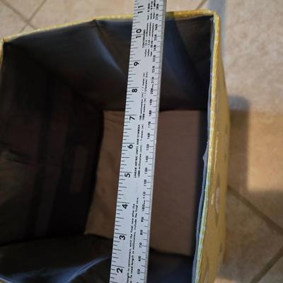 Three canvas like storage baskets and two picture frames