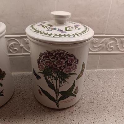2 PORTMEIRION BOTANIC GARDENS CANISTERS AND AN ENAMEL CONTAINER WITH FAUX FLOWERS