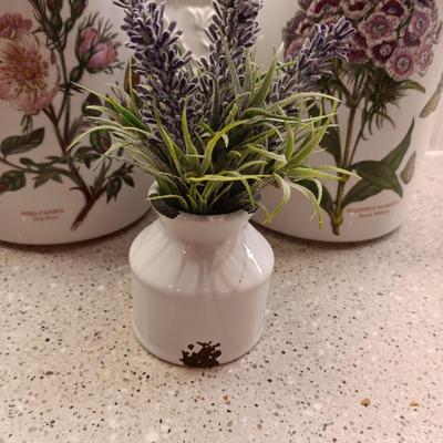 2 PORTMEIRION BOTANIC GARDENS CANISTERS AND AN ENAMEL CONTAINER WITH FAUX FLOWERS