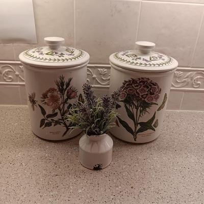 2 PORTMEIRION BOTANIC GARDENS CANISTERS AND AN ENAMEL CONTAINER WITH FAUX FLOWERS