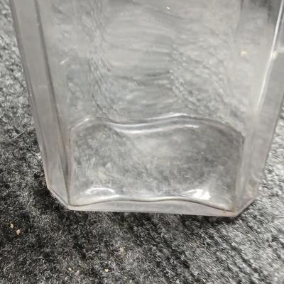 Antique embossed bottle with cork stopper
