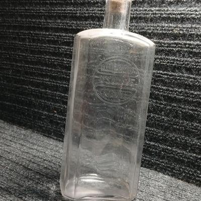 Antique embossed bottle with cork stopper
