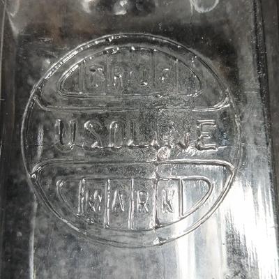 Antique embossed bottle with cork stopper