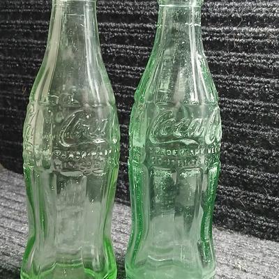 Two vintage Coca Cola Hobble Skirt Glass Soda Bottles marked LEESBURG FLA. - FLORIDA on base